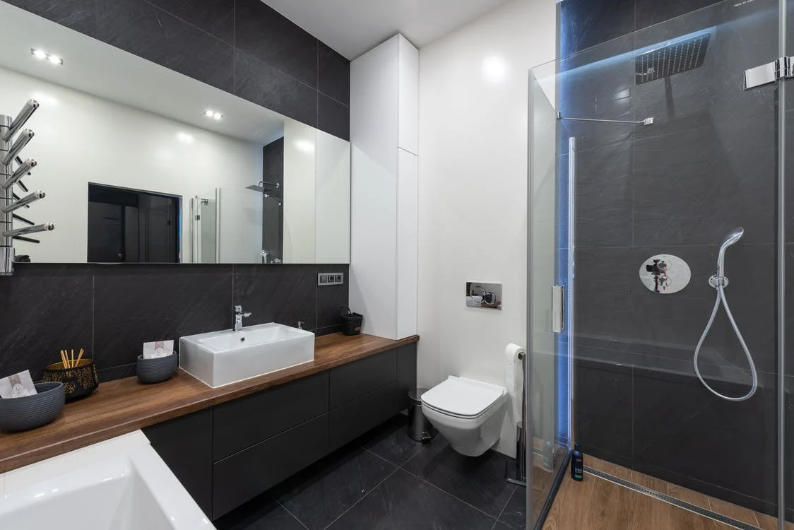 a bathroom with black walls